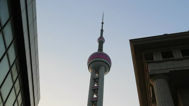 Panning Shot Of Oriental Pearl Tv Tower In City Against Sky - Shanghai, China