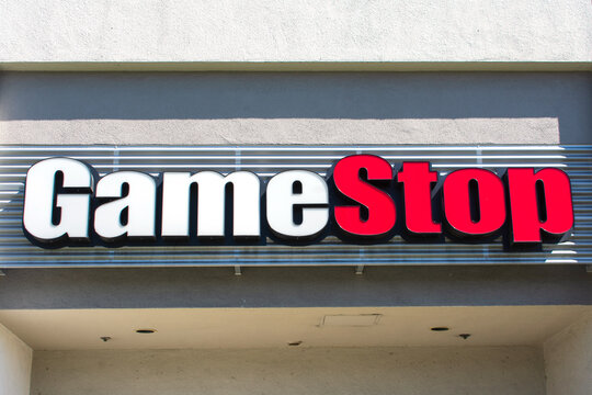 GameStop sign, logo on video game, consumer electronics, and gaming merchandise retail store location. - San Jose California, USA - 2021