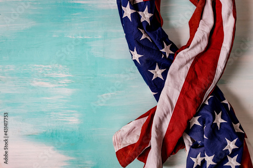 Close up of waving national usa american flag on wooden background.