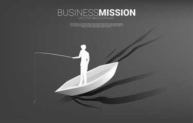 Silhouette of businessman standing with fishing hook on boat. Concept of targeting and bait in business.