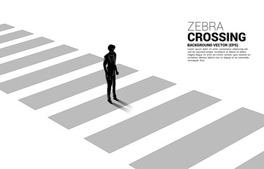 Silhouette of businessman standing on zebra crossing. Concept of safe zone and business road map.