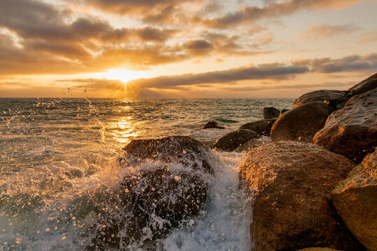 Sunset Ocean Wave Breaking Rocks