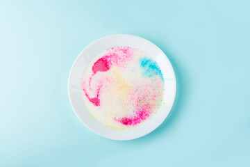 Fun kids science experiments. Step by step instruction: how to make colorful stains in milk. Step2 pour milk into a plate and add dye. Entertaining chemistry.