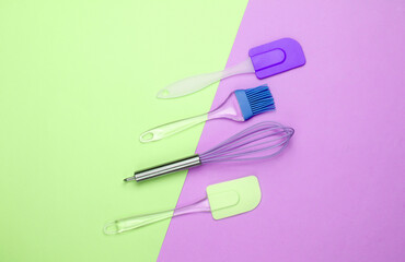 Flat lay compoisition of kitchen tools on pink green pastel background. Minimalism. Top view