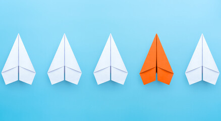 Business concept for new ideas creativity and innovative solution with orange paper plane standing...