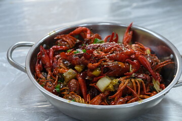close up steamed spicy Red Swamp Crayfish in pot on table. Chinese food