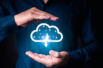 Businessman holding a cloud data icon with light and the binary number 1010. The concept of digital...