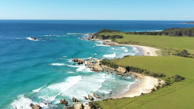 2020 - An excellent aerial shot of waves lapping the shores of Narooma Beach in New South Wales, Australia.