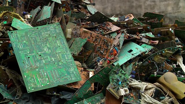 Close up of electronic waste in Africa - Edit of 3 clips - E-waste from Old Computers and Equipment, is a major concern to ecologists around the world.