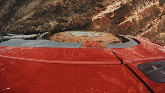 Industrial machinery. Truck Struggles Hard While Driving on Muddy Terrain. Interesting POV, Top view for a red truck wheel struggles hard while driving back and forth on mud and water. 4k footage