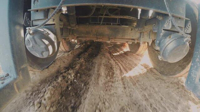 Truck driving on Muddy Terrain. 4K camera is under a truck while driving on mud and water, Interesting point of view. 4x4 Truck Drive. 4k footage.