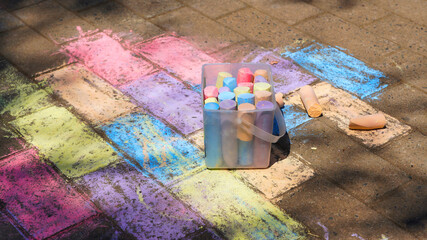 box of crayons on the sidewalk