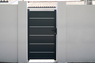 Modern grey door of house entrance in street city property real estate