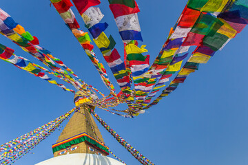 Colorful prayer flags on to the Boudhanath stupa in Kathmandu