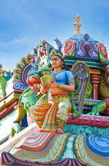 Beaituful Angel statue on hindu temple tower	
