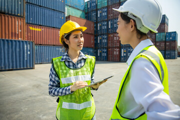 Head manager engineer teach and introduce or planning Business Logistics concept, Foreman control loading Containers box of cargo freight ship for Logistic planning and explain work with young worker