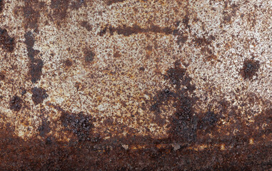Rusty metallic steel plate. Heavily worn red peeled rusty wall.