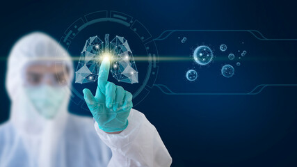 A doctor wearing a ppe gown touches a lung shape on a touchscreen. With a picture of the coronavirus on the side, healthy and technology concept