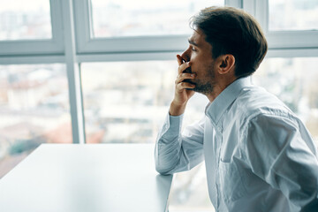 Man sitting at the table office emotions depression stress