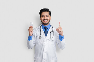 healthcare and medical concept - doctor with pill in hands isolated on white background with copy space