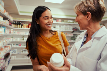 Senior pharmacist assisting of buying medical drug to buyer in pharmacy drugstore