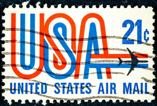 United States Airmail postage stamp shows image of Jet and text USA in red white and blue