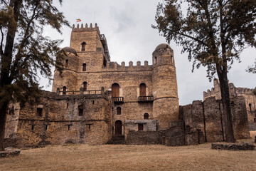 Fototapeta na wymiar ruins of famous african castle Fasil Ghebbi, Royal fortress-city in Gondar, Ethiopia. Imperial palace is called Camelot of Africa. UNESCO World Heritage Site.