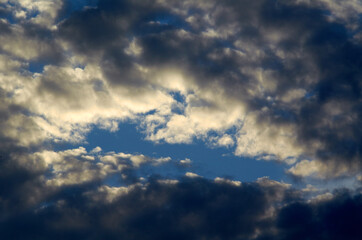 White clouds and light ray behind cloud with blue sky