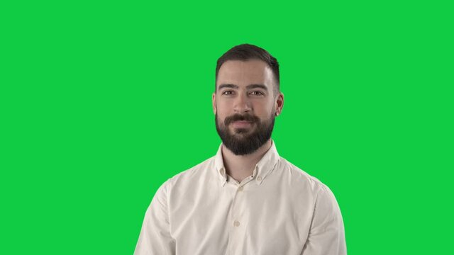 Happy young business man rotating and turning around 360 degrees. Portrait on green screen background.