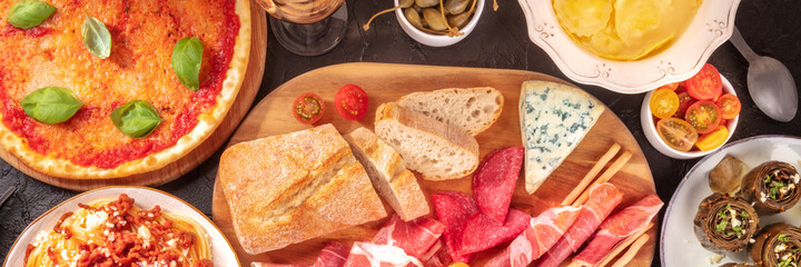 Italian cuisine panorama, shot from the top. Antipasti, pizza etc