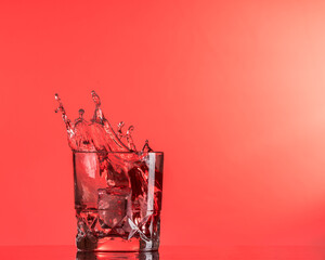 Red liquid spash with a red background