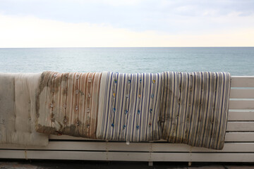 Old mattresses on bench