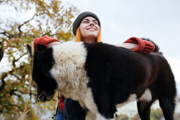 woman hiker in nature with dog rest fun friendship