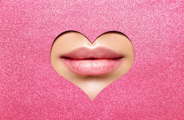 Beauty Lips Makeup Close up. Natural Plump Bright Lip Glossy Lipstick look through Heart Shaped...