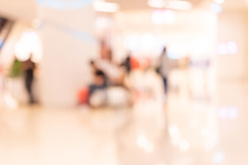 Abstract defocused or blurred background of the shopping mall with nice department store interior. which including of people and shop store.	