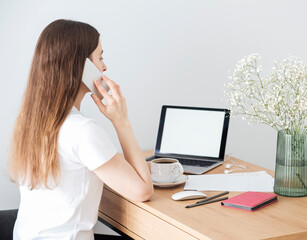 Young girl working at home office