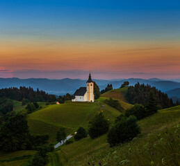 Sveti Andrej, Slovenia - Saint Andrew church (Sv. Andrej) at sunset in Skofja Loka area with Julian...