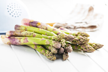 Fresh raw uncooked green asparagus.