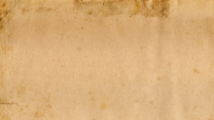 An old paper sheet, warm sepia color tones due to aging, horizontal shot. Useful texture or...