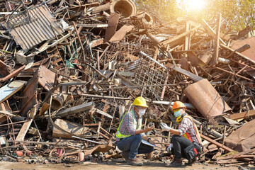 Recycling industry a worker who recycling thing on recycle center.Manager and Manual Worker in Metal Landfill