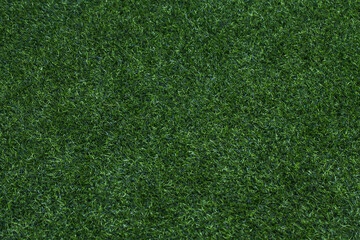 Obraz premium Green grass texture for golf course, soccer field or sports background. Concept design of Artificial green grass for design with copy space for add text or image.