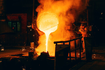 Metal Casting process in Foundry, Molten Iron pours from ladle to Blast Furnace.