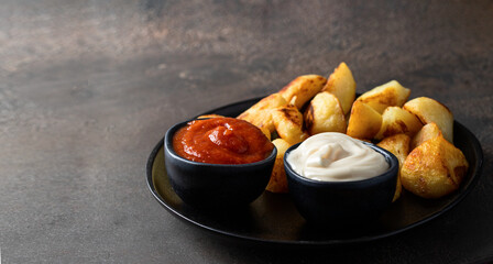Popular Spanish tapa. Patatas bravas, fried potatoes served with spicy tomato sauce and aioli on...