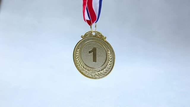 Winner or champion gold trophy medal on concrete stone grey background. Victory first place of competition. Winning or success concept.