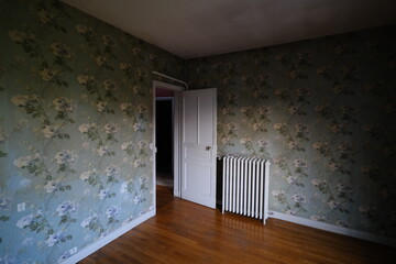 An empty room before the sale of an old house. April 2021, France, parisian suburbs.