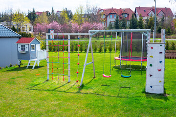 Obraz na płótnie Canvas Garden playground for children with a climbing wall