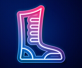 Glowing neon line Sport boxing shoes icon isolated on blue background. Wrestling shoes. Vector
