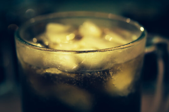 Refreshing Bubbly Soda Pop with Ice Cubes. Cold soda iced drink in a glasses - Selective focus, shallow DOF	
