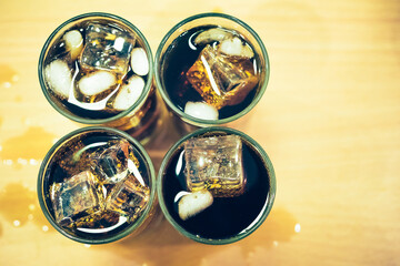 Refreshing Bubbly Soda Pop with Ice Cubes. Cold soda iced drink in a glasses - Selective focus, shallow DOF	
