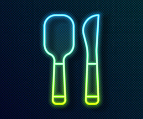 Glowing neon line Knife and spoon icon isolated on black background. Cooking utensil. Cutlery sign. Vector